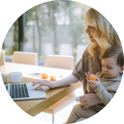 Man sitting smiling at his laptop while on a telehealth consult.